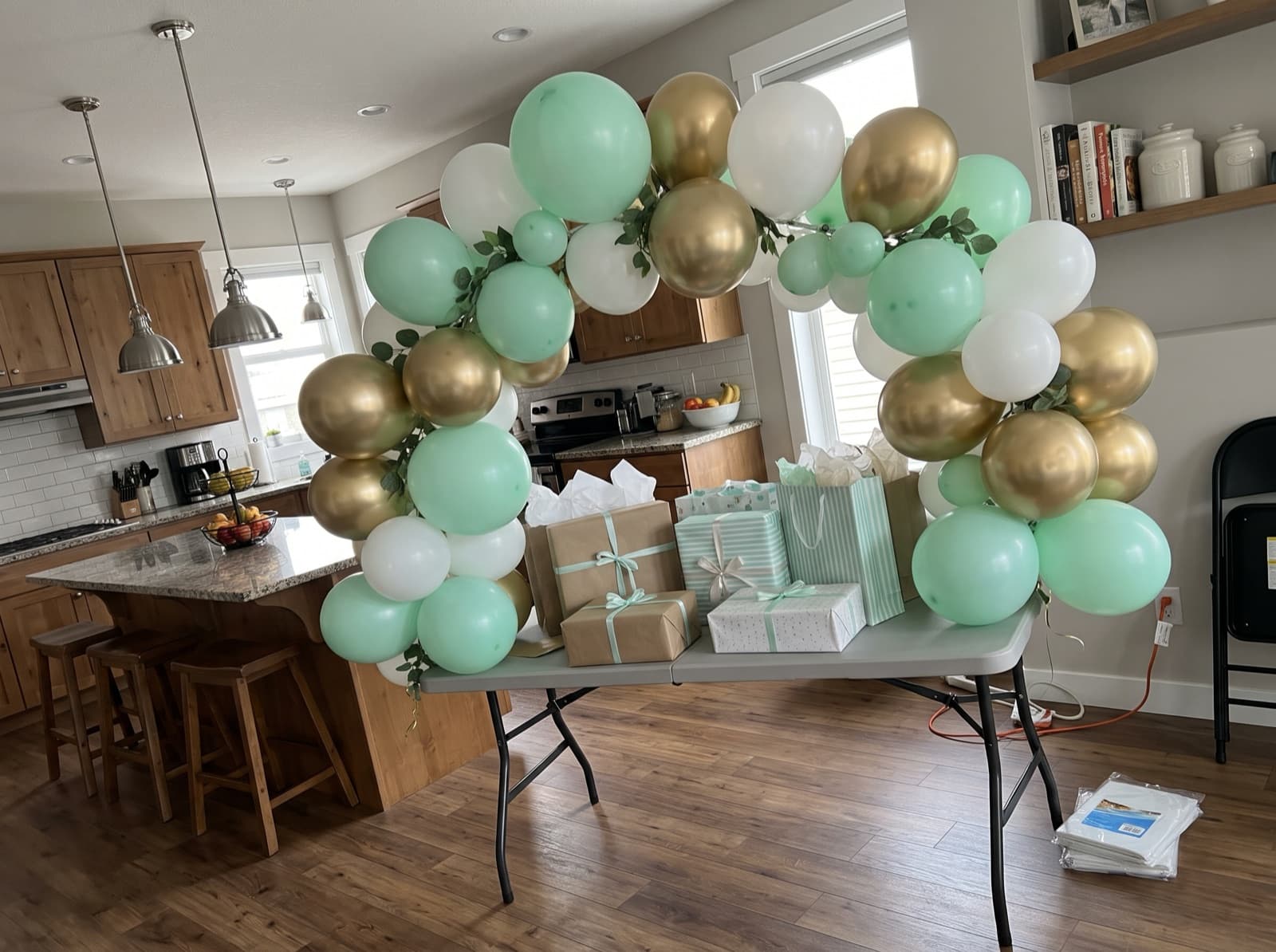 Mini tabletop balloon arch over a gift table