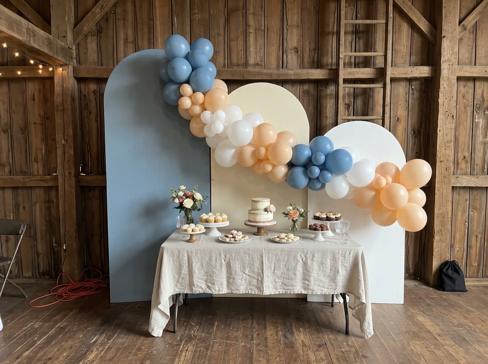 Chiara arched backdrop trio with a balloon garland
