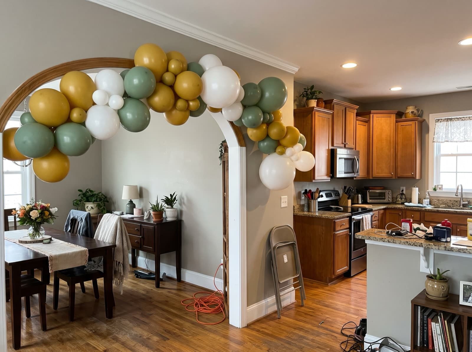 Balloon garland around an arched interior doorway