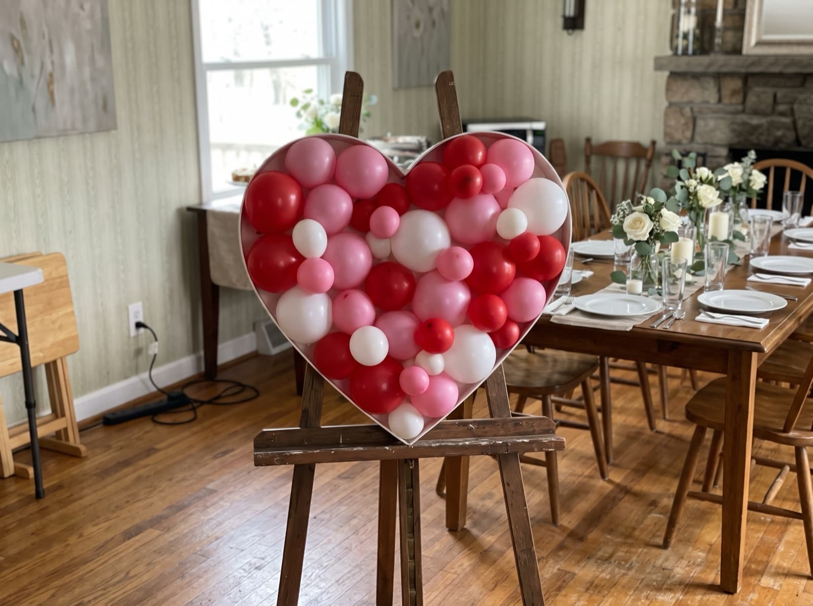 Heart-shaped balloon mosaic in red, pink and white