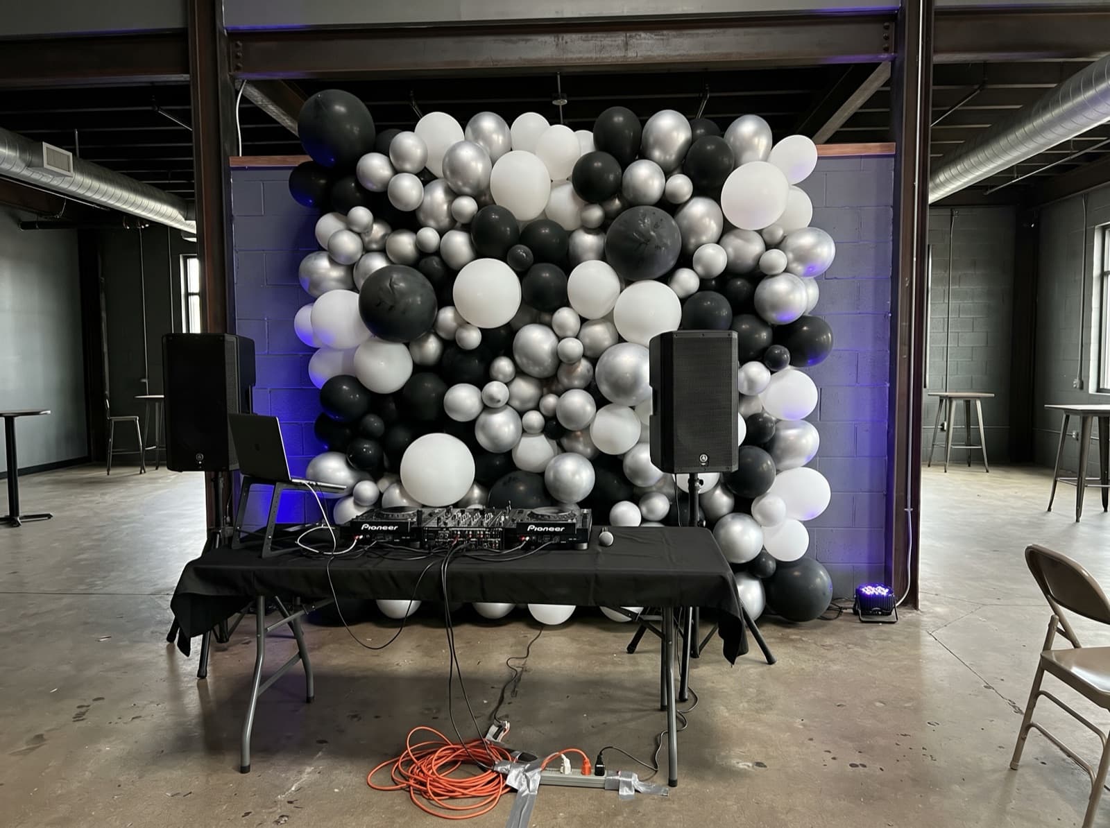 Balloon wall behind a DJ booth
