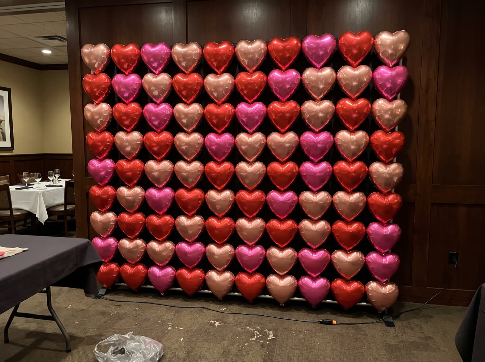 Foil heart balloon wall in red, pink and rose gold